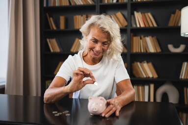 Saving,Money,Investment,For,Future.,Senior,Adult,Mature,Woman,Putting