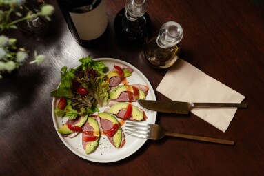 Avocado,And,Smoked,Duck,Salad,Served,On,Elegant,Table,Setting