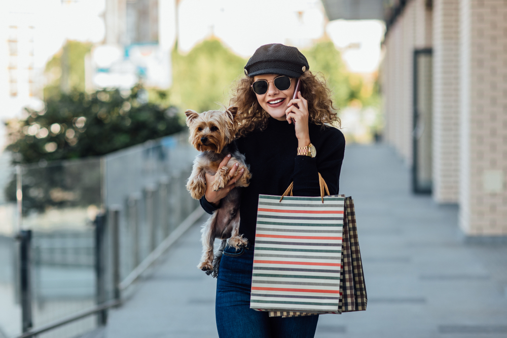 Fashion,Walk,Woman,With,Long,Curly,Hair,Holds,Small,Dog