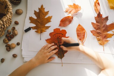 A,Young,Boy,Concentrates,On,A,Creative,Activity,,Using,Assorted