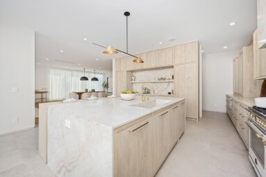 Modern,Minimalist,Kitchen,With,Light,Wooden,Cabinetry,,Marble,Countertops,,And