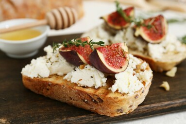 Wooden,Board,Of,Delicious,Fig,Bruschetta,With,Ricotta,Cheese,And