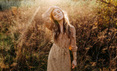 Young,Woman,With,Long,Blonde,Wavy,Hair,,Walking,In,A