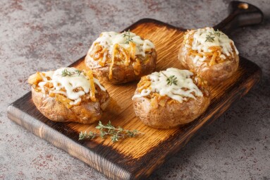 French,Onion,Soup,Stuffed,Potatoes,Topped,With,Cheese,Closeup,On