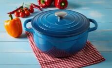 A,Vibrant,Blue,Enameled,Cast,Iron,Dutch,Oven,Sits,On