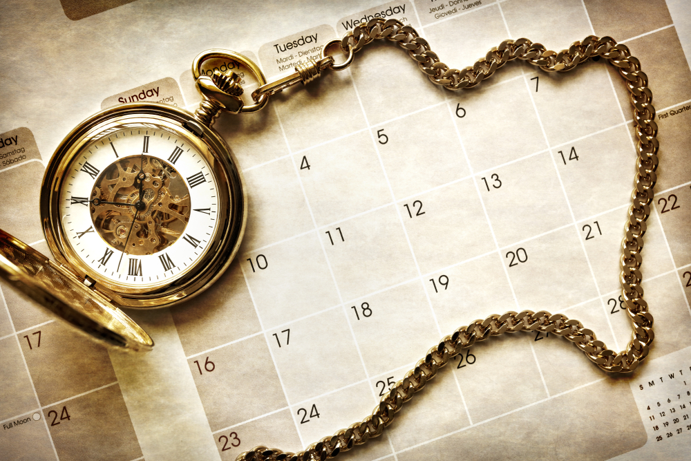 Time,Management,,Gold,Pocket,Watch,On,Blank,Calendar,Background
