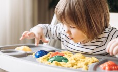 Cute,Little,Boy,Playing,With,Kinetic,Sand.,Development,Of,Fine