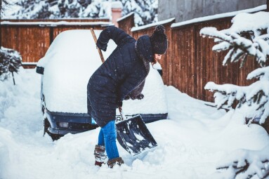 Woman,With,Shovel,Cleaning,Snow,Aeound,Car.,Winter,Shoveling.,Removing