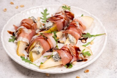 Enjoy,A,Plate,Of,Sliced,Pears,Topped,With,Creamy,Blue