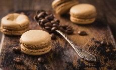 French,Coffee,Macaroons,With,Ganache,Filling,And,Spoon,With,Coffee