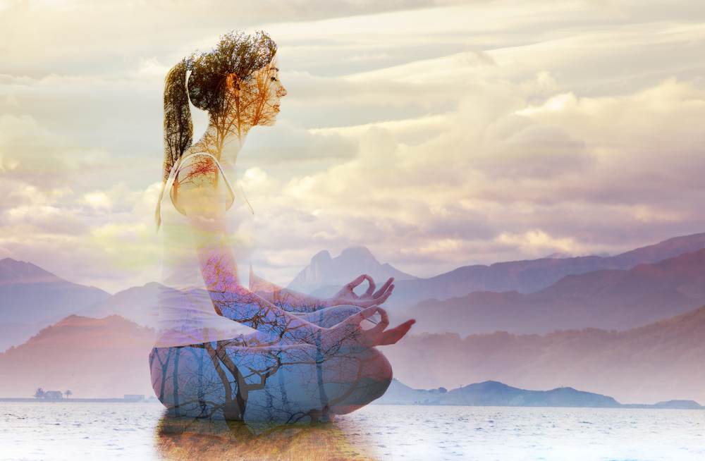 Double,Exposure,Of,Silhouette,Of,Woman,Doing,Yoga,In,Lotus