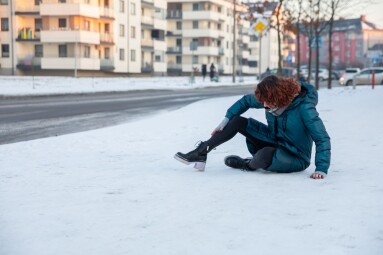 The,Girl,Slipped,On,The,Icy,Sidewalk,While,Walking.