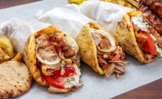 Gyro,Doner,Shawarma,Wraps,Stuffed,With,Roasted,Meat,,Onions,,Tomato