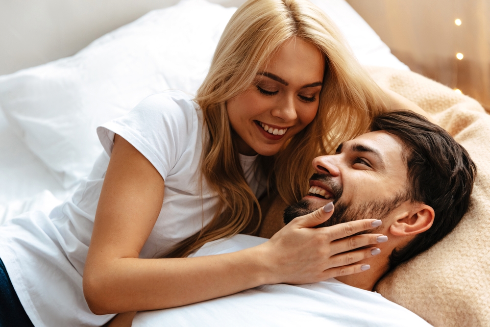 Amidst,Love,And,Laughter,,A,Young,Couple,Lies,On,A