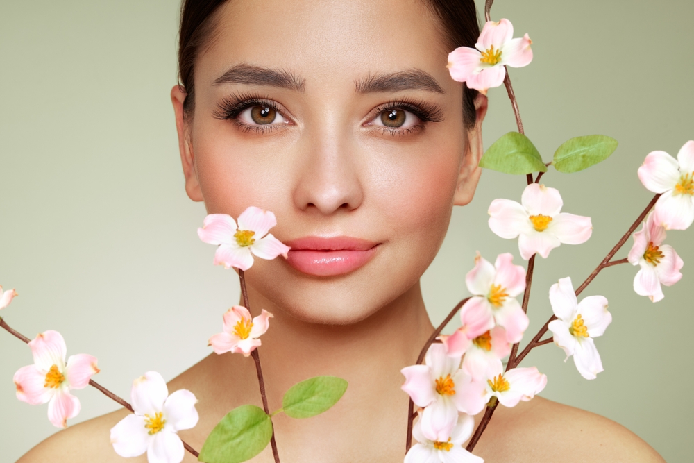 Beautiful,Young,Woman,With,A,Cherry,Blossom,Branch.,Model,With