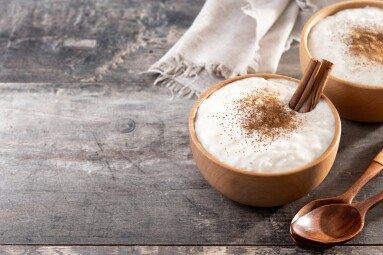Rice,Pudding,On,Wooden,Bowl,On,Wooden,Table.,Copy,Space