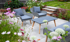 Outdoor,Living,,Terrace,In,The,Garden,With,Flowers