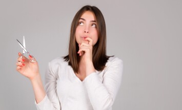 Woman,With,Scissors,Having,Hair,Cut.,Amazed,Girl,With,Straight