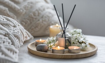 Home,Comfort,,Coziness,,Aromatherapy.,Cozy,Interior,With,Knitting,,Burning,Candles