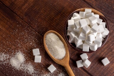 White,Sugar,Cubes,In,Wooden,Bowl.