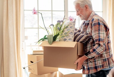 Hipster,Smiling,Senior,Man,Involved,In,Moving,House,Moving,Cardboard