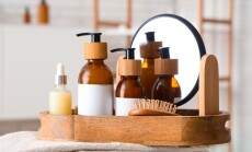 Bottles,Of,Cosmetic,Products,And,Bath,Supplies,In,Wooden,Tray