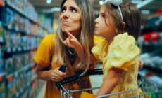 Little,Girl,Showing,Her,Mother,What,She,Wants,To,Buy.