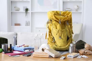 Survival,Kit.,Different,Emergency,Supplies,On,Wooden,Table,Indoors