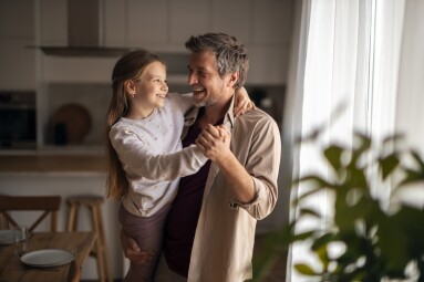 Happy,Father,Holding,And,Dancing,With,His,Young,Daughter,In