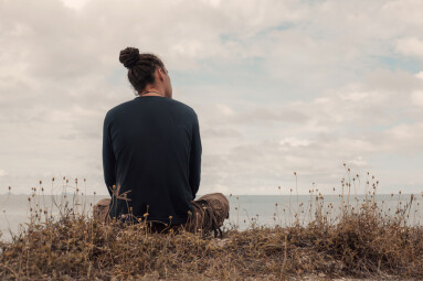 Attractive,Young,Man,Watching,Horizon,Line,On,Sea,Shore.,Back