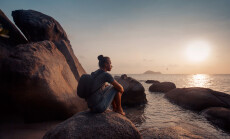 Young,Man,Traveller,With,Backpack,Watching,Sunset