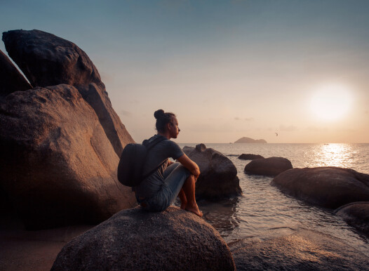 Young,Man,Traveller,With,Backpack,Watching,Sunset