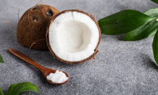 Wooden,Spoon,Of,Coconut,Oil,On,A,Gray,Table,Coconut