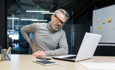 Sick,Senior,Man,Working,Inside,Office,Modern,Building,,Overtired,Mature