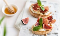 Delicious,Bruschetta,With,Prosciutto,,Creme,Cheese,,Figs,,Basil,,Walnut,And
