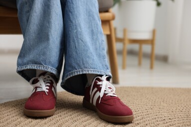 Woman,Wearing,Stylish,Sneakers,At,Home,,Closeup