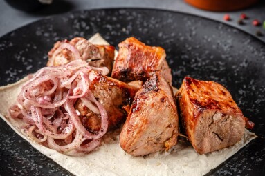 Juicy,Grilled,Pork,Shashlik,Served,With,Pickled,Onion,On,Lavash