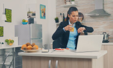 Business,Woman,Late,At,The,Office,While,Eating,Breakfast.,Young