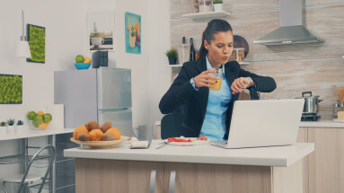 Business,Woman,Late,At,The,Office,While,Eating,Breakfast.,Young