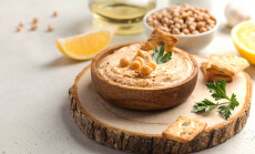 Hummus,In,A,Wooden,Plate,,Chickpeas,,Croutons.,Dishes,Of,Chickpeas,