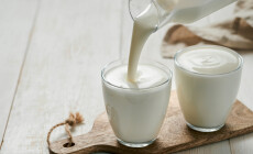 Pouring,Homemade,Kefir,,Buttermilk,Or,Yogurt,With,Probiotics.,Yogurt,Flowing