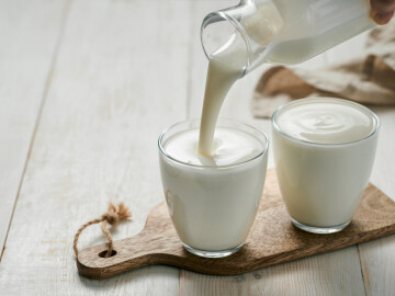Pouring,Homemade,Kefir,,Buttermilk,Or,Yogurt,With,Probiotics.,Yogurt,Flowing