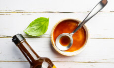 Worcestershire,Sauce,In,A,Bowl,With,Spoon,And,Bottle,Over