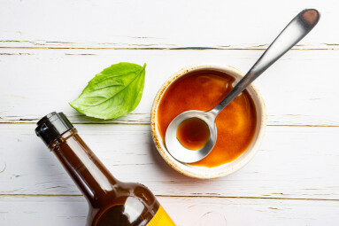 Worcestershire,Sauce,In,A,Bowl,With,Spoon,And,Bottle,Over