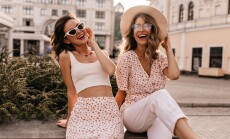 Cheerful,Caucasian,Young,Girls,Are,Sitting,In,Center,Of,City