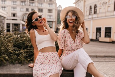 Cheerful,Caucasian,Young,Girls,Are,Sitting,In,Center,Of,City