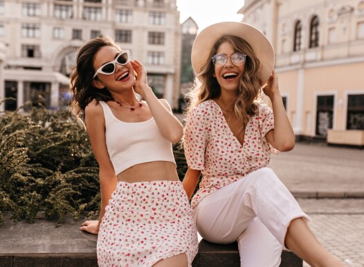 Cheerful,Caucasian,Young,Girls,Are,Sitting,In,Center,Of,City