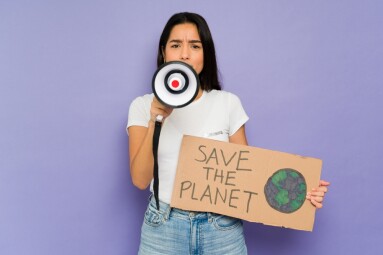 Stressed,Hispanic,Woman,With,A,Megaphone,Asking,Big,Companies,To