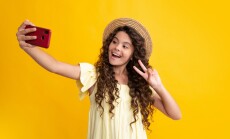 Kids,Selfie.,Cute,Teen,Child,Girl,Paying,With,Phone,,Texting