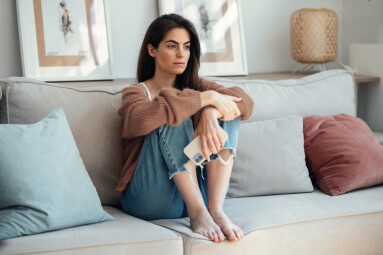 Shot,Of,Sad,Young,Woman,Overthinking,While,Holding,Mobile,Phone